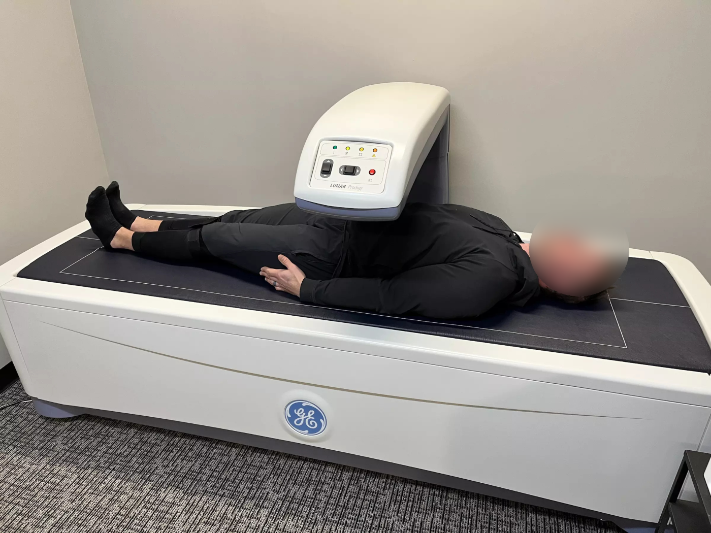 A person undergoing a DEXA body-composition scan